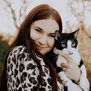 Image of Allayna from Indiana Connections Career Academy pictured here holding her cat. 